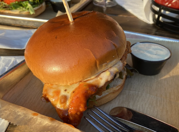 Bear and The Butcher signature dishes Fried Chicken Sandwich2 Pounds WingsPretzels and Beer Cheese